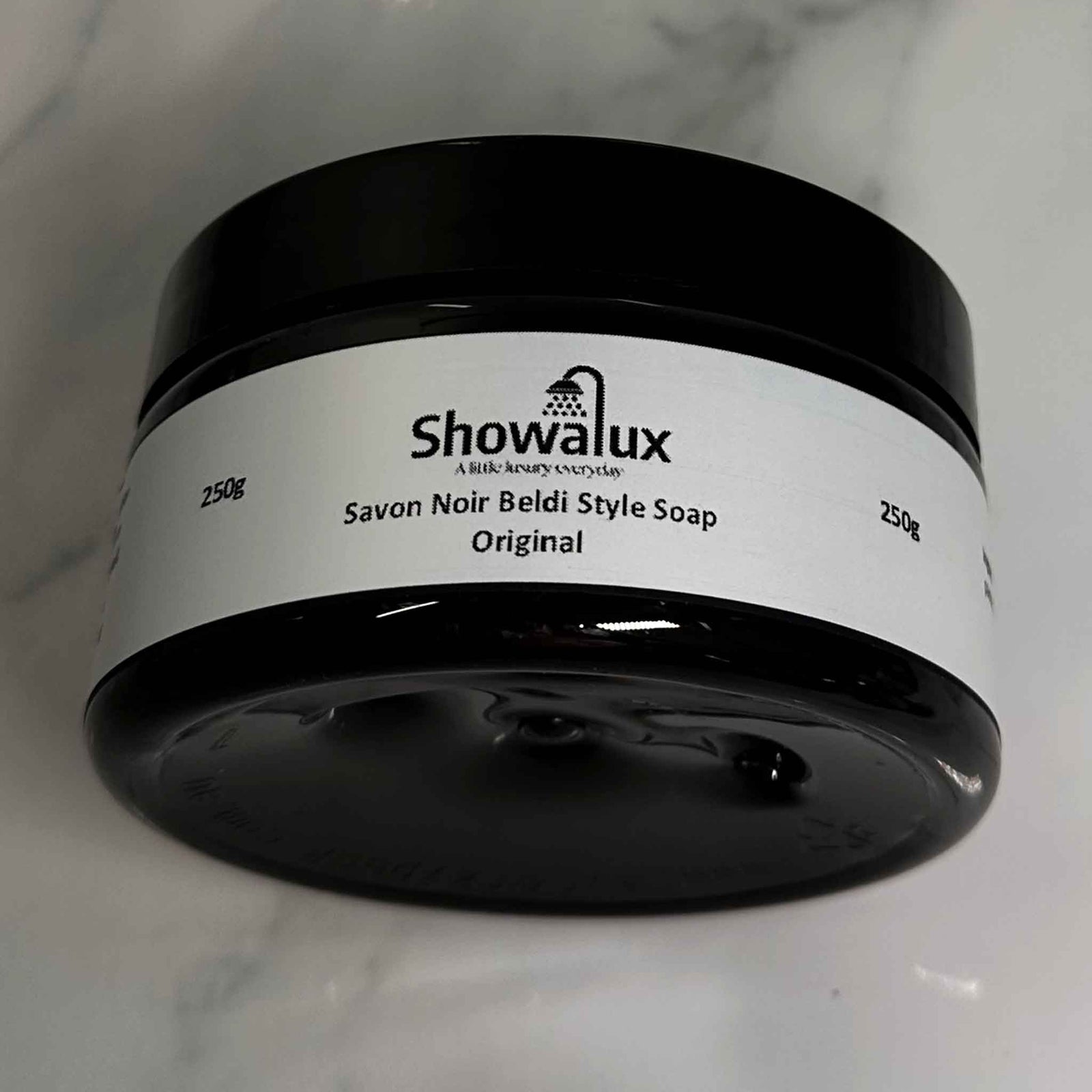 Side view of Beldi Soap jar displaying the name and weight