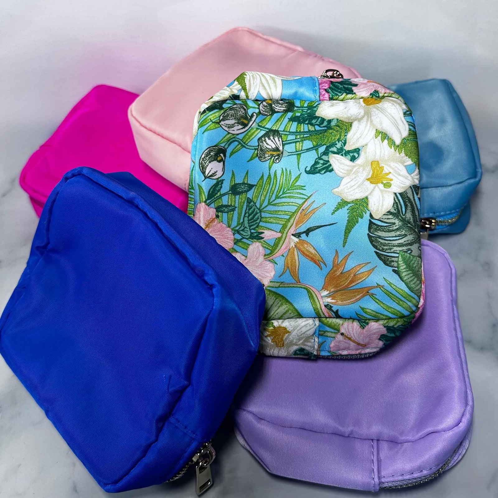 Floral-patterned, pink, blue, and purple Showalux personal bags
