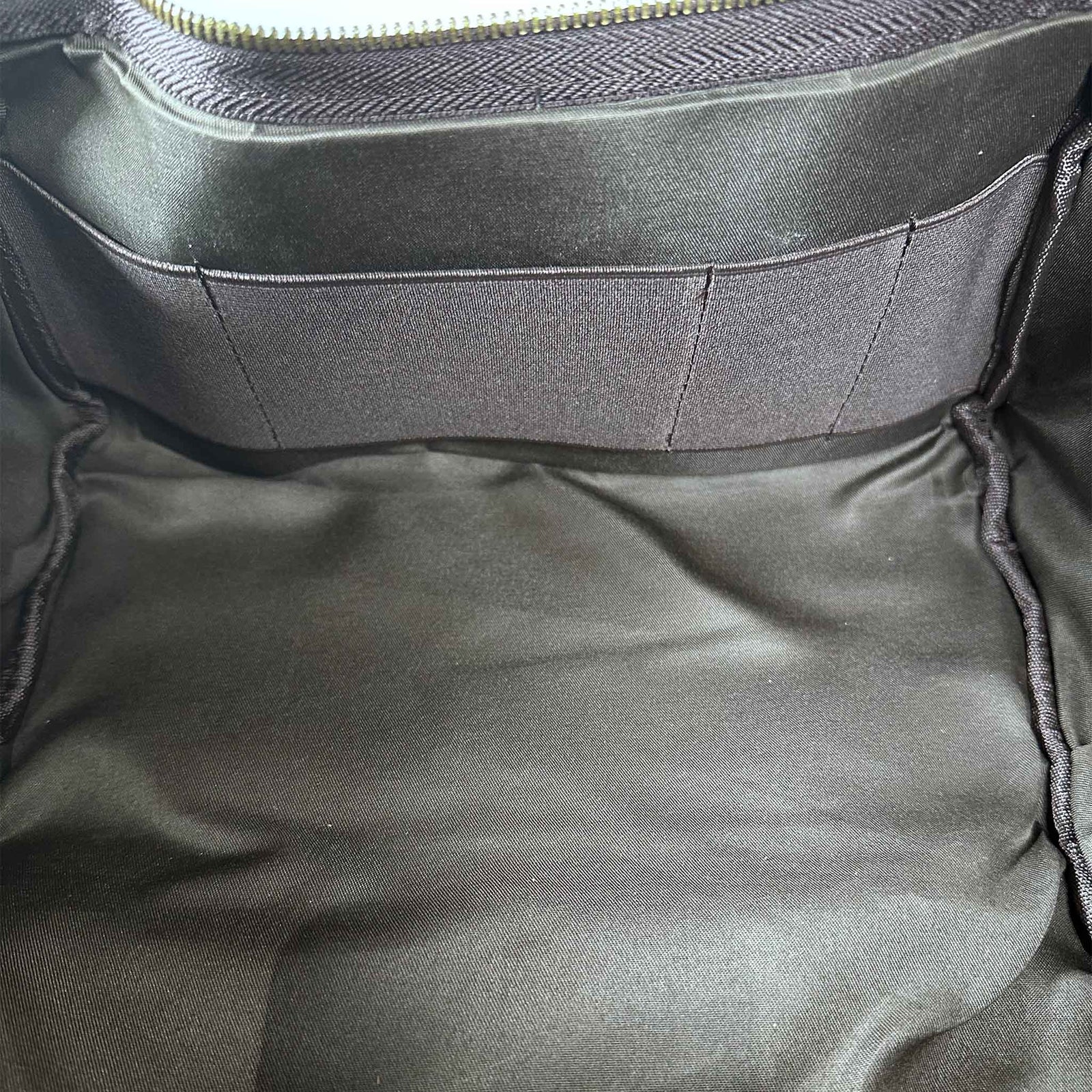 Close-up of a interior of brown bag with a zipper