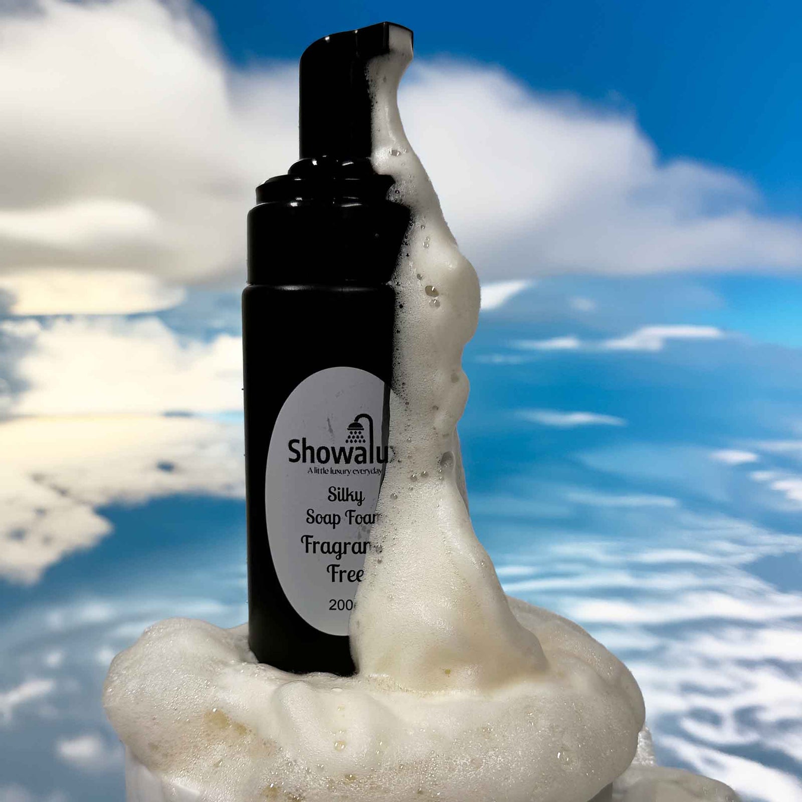 ShowaLux bottle with foamy soap on a blue sky background