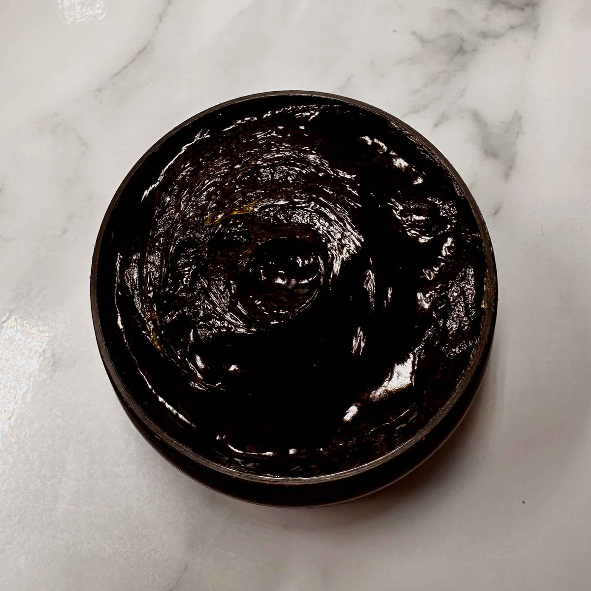 Top view of Beldi soap paste in a jar