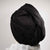 Showing wearing the black hair wrap with white towel round the neck on a white background