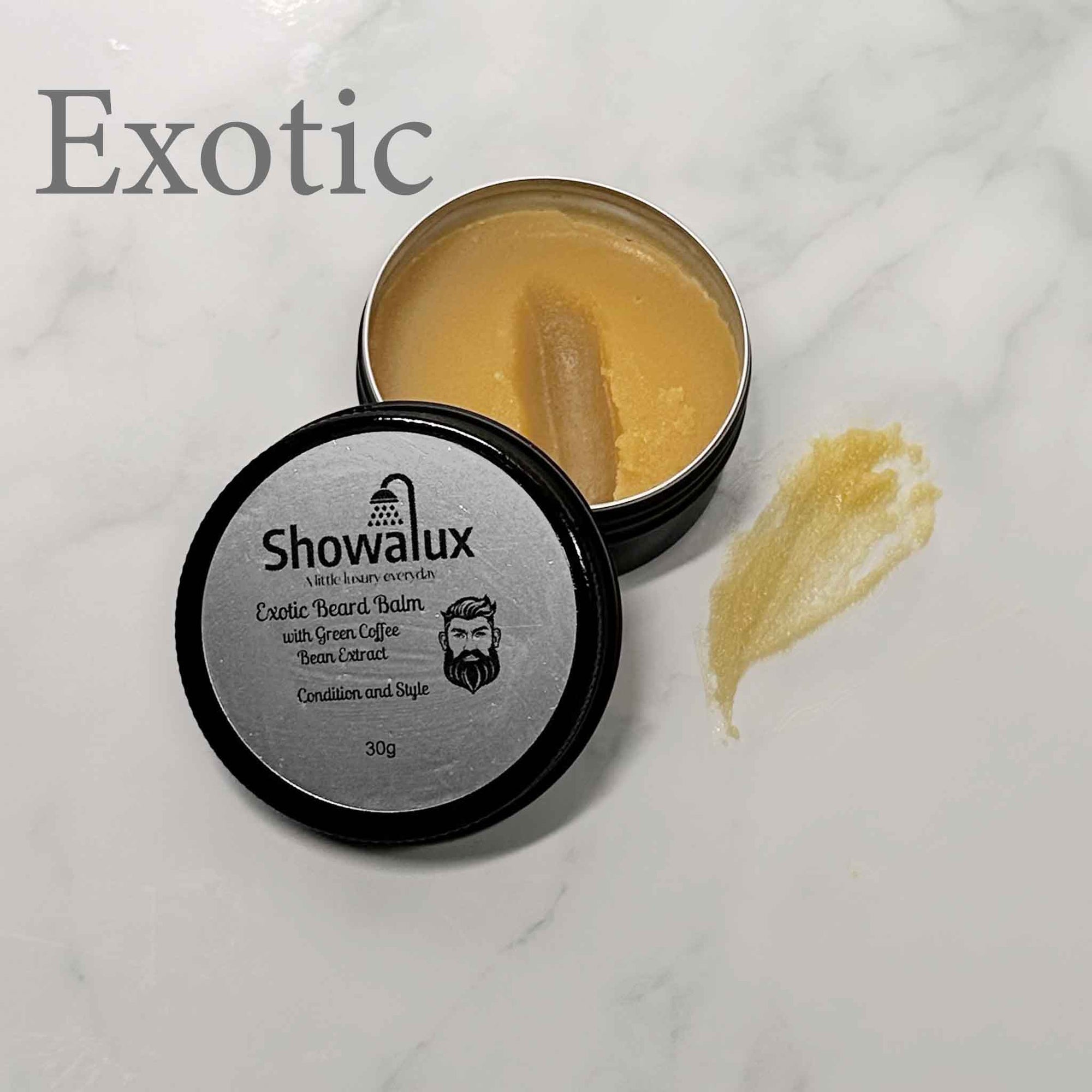 Four Showalux beard balm containers on a marble surface with a small yellow product between them.