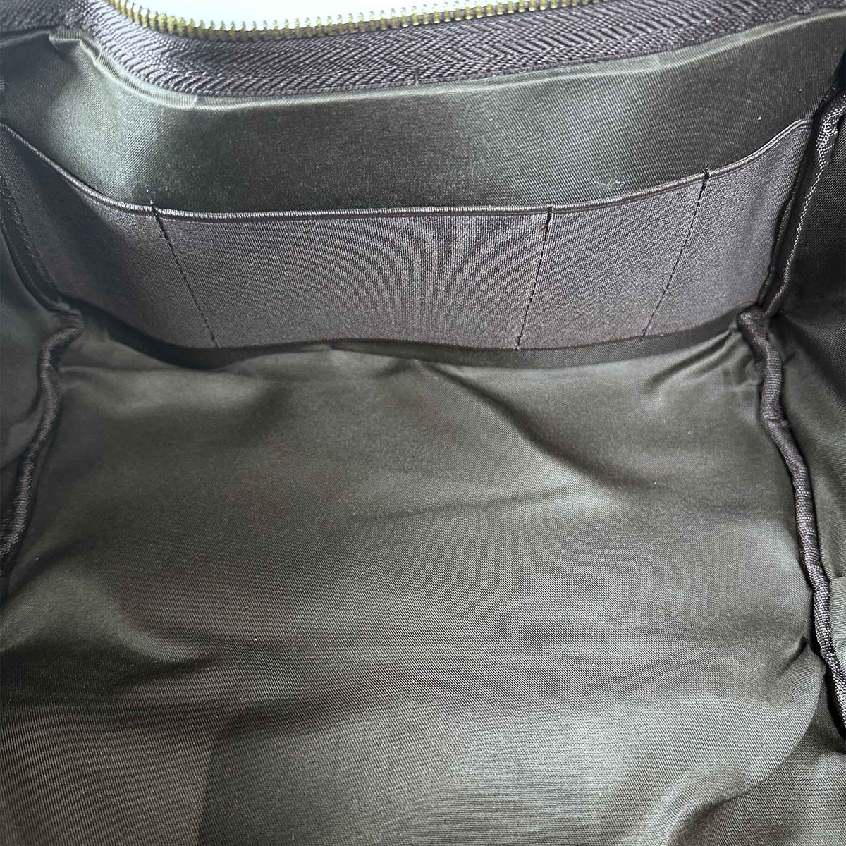 Close-up of a interior of brown bag with a zipper