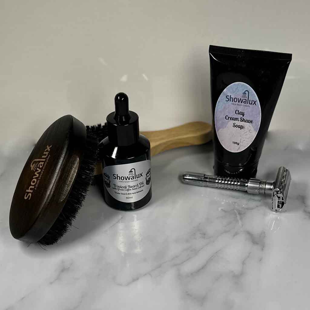 Showvalux grooming products including a Showalux brush, bottle, and tube on a marble surface.