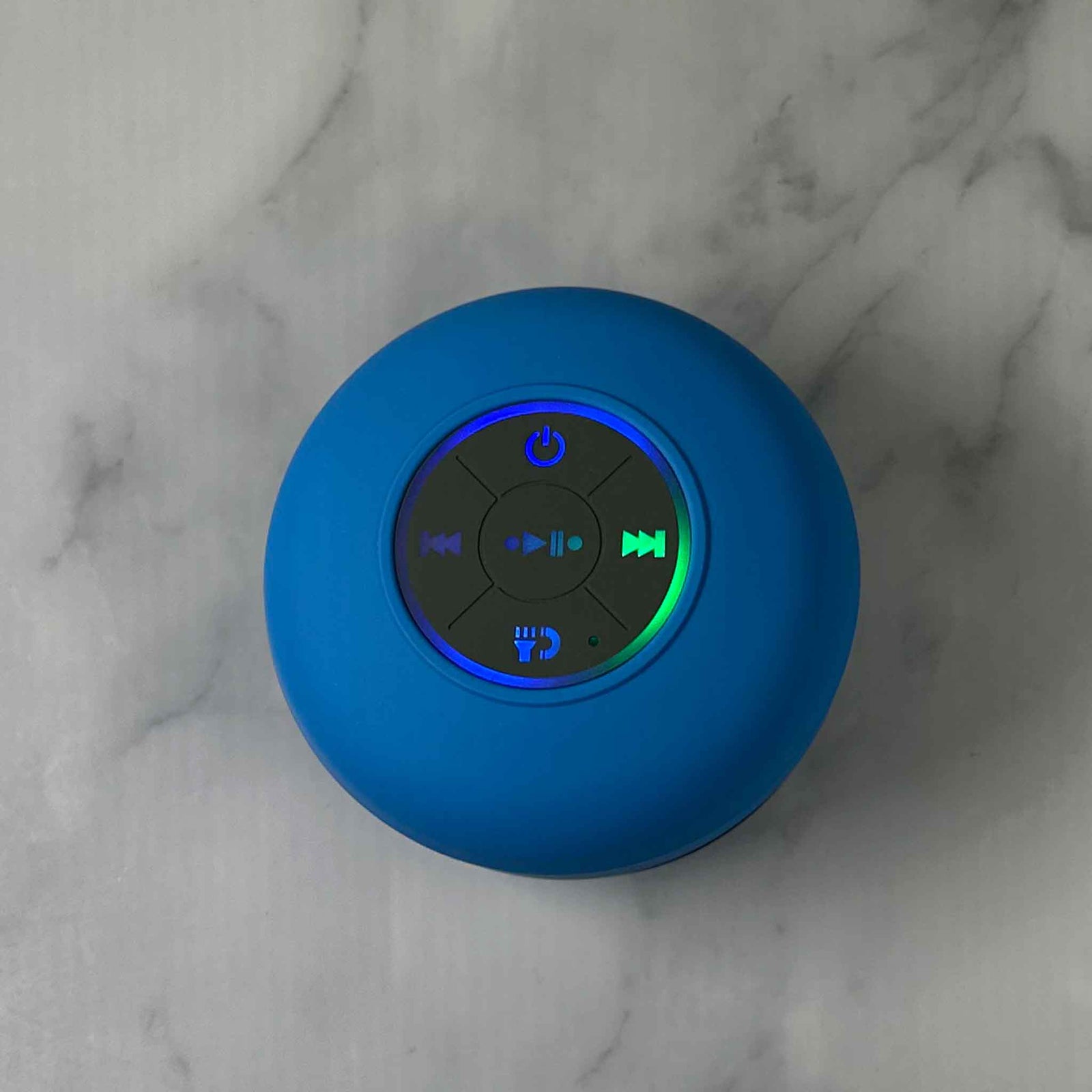 Showalux Blue Speaker with colorful buttons on a marble background