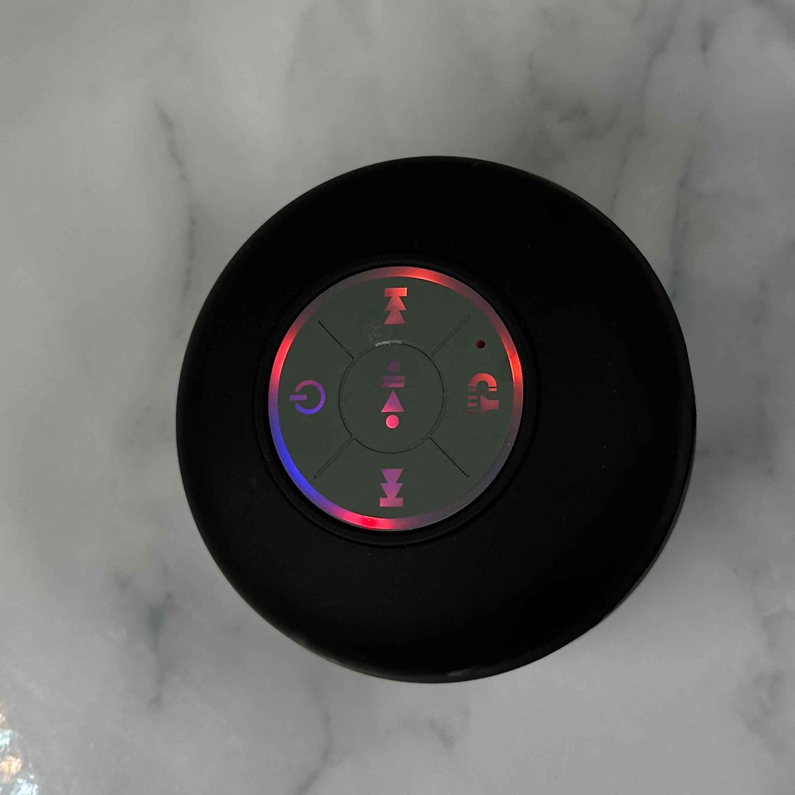 Showalux Black Speaker with colorful buttons on a marble background