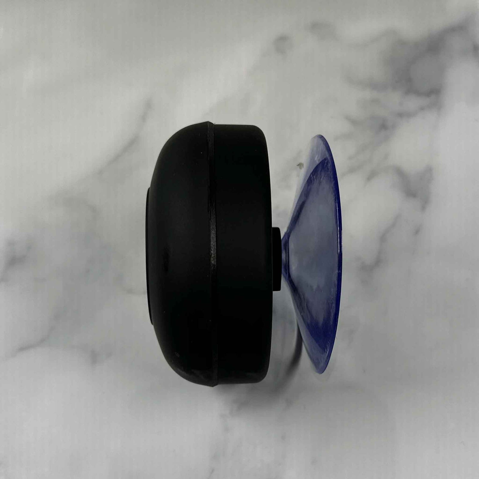 Showalux wireless speaker with packaging and USB cable on a marble surface
