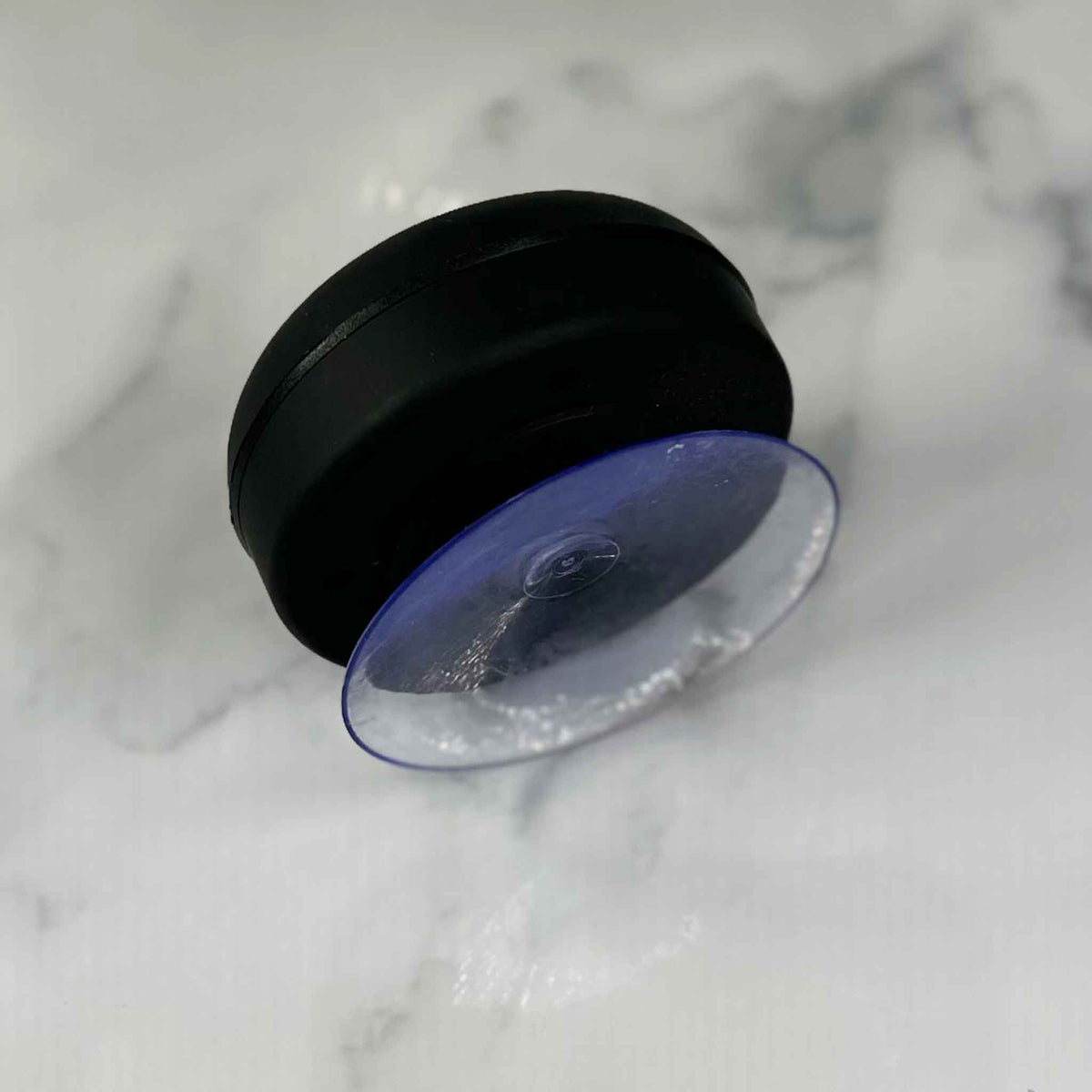 Showalux Black speaker suction cap on a marble surface